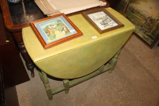 A painted gate leg dining table