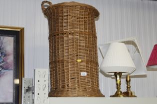 A circular wicker linen basket