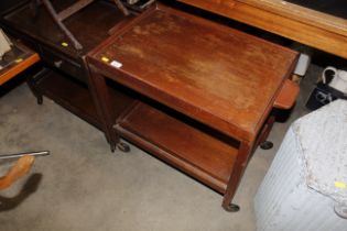 Two oak tea trolley on casters