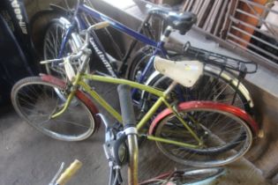 A child's Triumph bicycle with front and rear mud