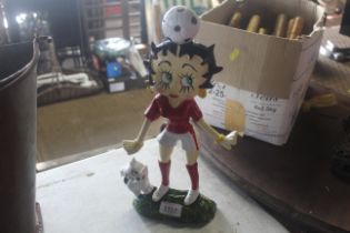 A painted cast iron door stop of Football Betty Bo