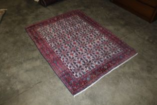 An approx. 5'2" x 4' red and blue pattern Eastern