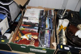 A box of DVDs, Videos games etc