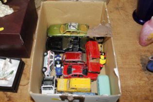 A box of die cast Corgi and other toys