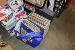 A case and a bag of LPs