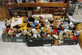 Three boxes of various soft toys