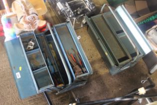 Two metal cantilever tool boxes - one with some co