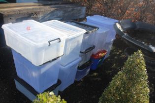 A quantity of plastic storage boxes