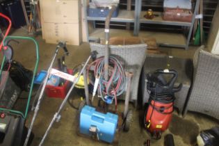 A gas bottle trolley with hoses and plastic tool b