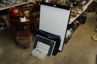 A freestanding white board, a drawing board, furth