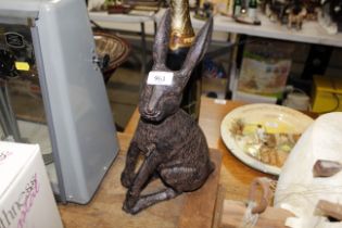 A cast metal figure of a hare (106)