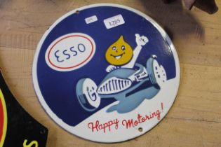 A circular enamelled metal sign for Esso "Happy Motoring" (224)