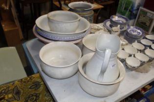 A quantity of large china bowls, jug and three cha