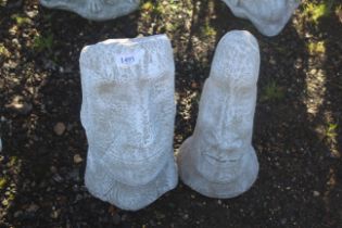 Two cast concrete garden ornaments in the form of Easter Island heads