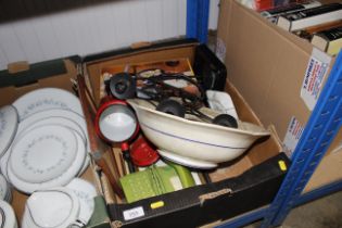 A box containing telephones, red enamel pot with l
