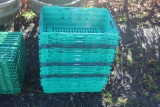 A quantity of plastic stacking vegetable crates