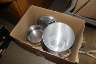 A box containing saucepans, preserve pan etc.