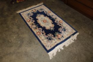 An approx. 6' x 3'1" Chinese wool rug