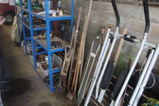 A quantity of long handled garden tools to include