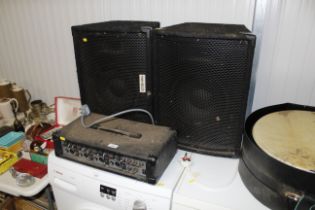 A pair of Meridian speakers and a Meridian four ch