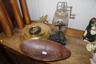 A glass blown hand operated butter churn, butter dish, wooden dish, candle stand of a penny farthing