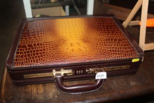 A faux crocodile skin briefcase