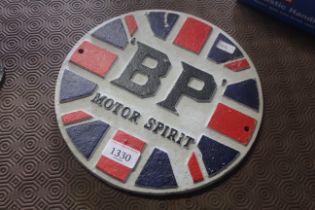 A painted circular cast iron sign for "BP Motor Sp