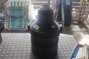 A small metal bound milk churn with hinged lid and