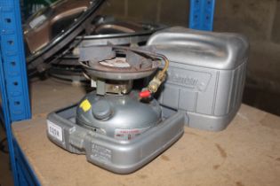 A Coleman Dual Fuel 533 camping stove in fitted pl