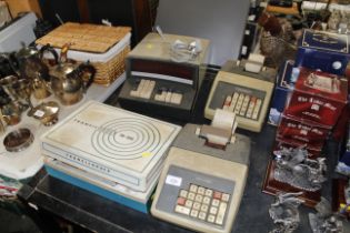 Three various vintage calculators and a vintage Tr