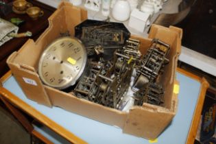 A box containing various clock movements