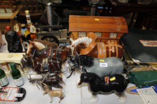 A quantity of heavy horse ornaments, carts etc