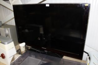 A Samsung flat screen tv lacking remote