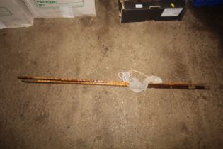 A cane three piece fishing rod in carry bag