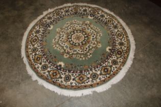 A 5' dia. floral pattern wool rug