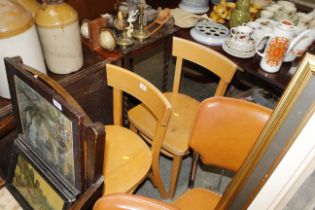 A pair of 1950s style kitchen chairs