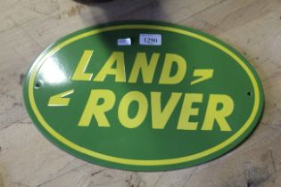 An oval enamelled metal sign for "Land Rover" (225