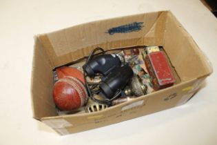 A box containing lighter, whistle, watch, gem ston