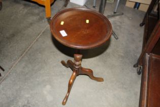 A small mahogany wine table