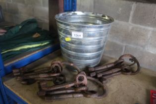 A small metal bucket and three sets of large vinta