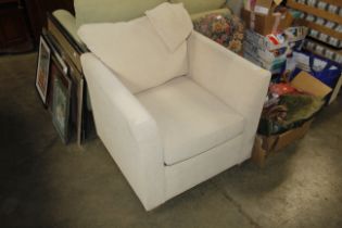 A beige easy chair