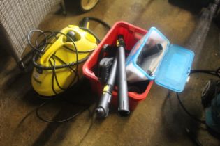 A Karcher SC1.20 steam cleaner with various accessories