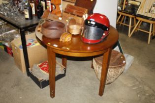 A mahogany demi lune drop leaf table