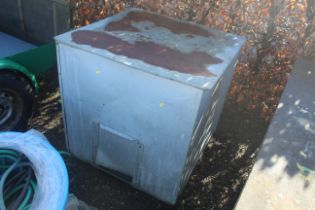 A galvanised metal coal bin