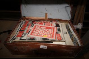 A vintage suitcase containing various sheet music etc.