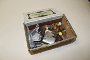 A cigar box containing lighters, costume jewellery