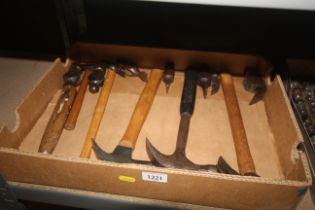 A box containing an assortment of hammers and hamm