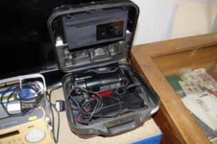 A JVC video camera in case with charger and batter