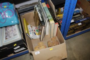 A box of various Art books and two cottage ornamen