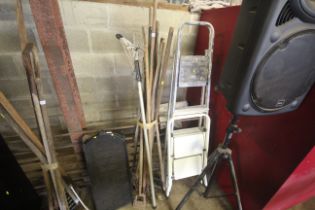 A quantity of long handled garden tools to include